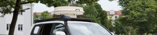 Car with mobile monitoring equipment on top