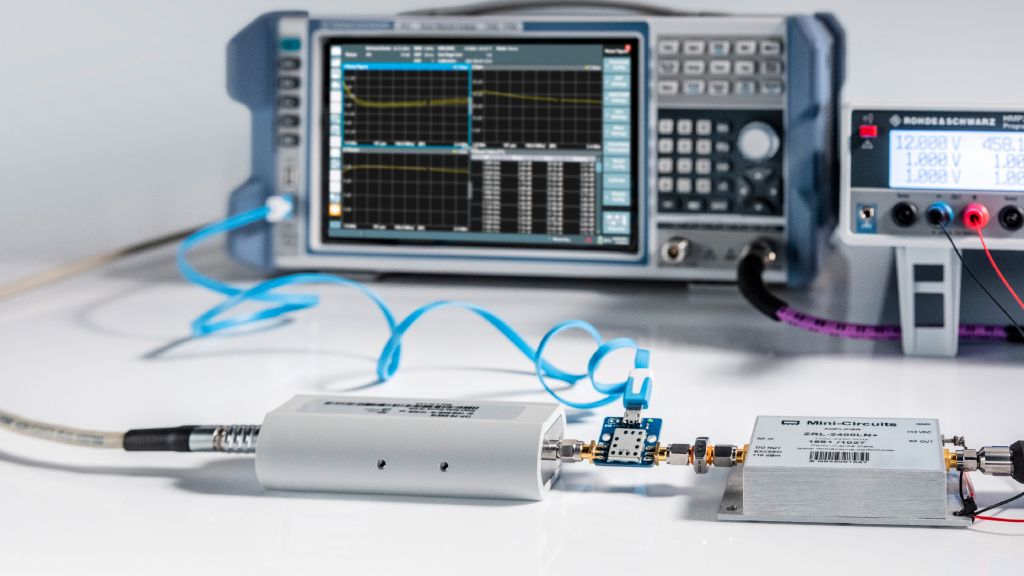 Measuring amplifier noise figure with R&S®ZNL (back), an R& S®FS-SNS18 (left) and an external pre-amplifier (right) powered by an R&S®HMP2030 programmable power supply (back right).